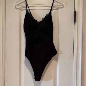 Black Floral Lace Bodysuit with Rear Zipper, Snap Crotch, and Adjustable Straps.